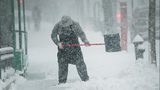 FILE PHOTO: A man shovels snow in the Brooklyn borough of New York City. (Photo by Spencer Platt/Getty Images)