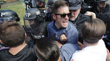 White nationalist Richard Spencer (C) and his supporters clash with Virginia State Police in Emancipation Park after the "Unite the Right" rally was declared an unlawful gathering August 12, 2017 in Charlottesville, Virginia.