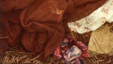 Pictured are the blanket, sheet and shirt found in the ditch where a newborn boy, his umbilical cord and placenta still attached to his body, was found frozen to death Feb. 28, 1981, in Sioux Falls, South Dakota.
