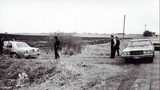 Investigators are shown at the ditch where a newborn boy, his umbilical cord and placenta still attached to his body, was found frozen to death Feb. 28, 1981, in Sioux Falls, South Dakota.
