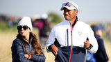 Tiger Woods (R) of the United States celebrates with his girlfriend Erica Herman (L) and son Charlie Axel (C) as he comes off the 18th green in celebration of his win during the final round of the Masters at Augusta National Golf Club on April 14,